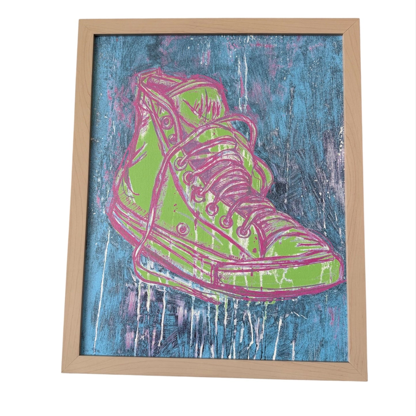 Framed artwork of a green and pink high-top sneaker on a blue textured background