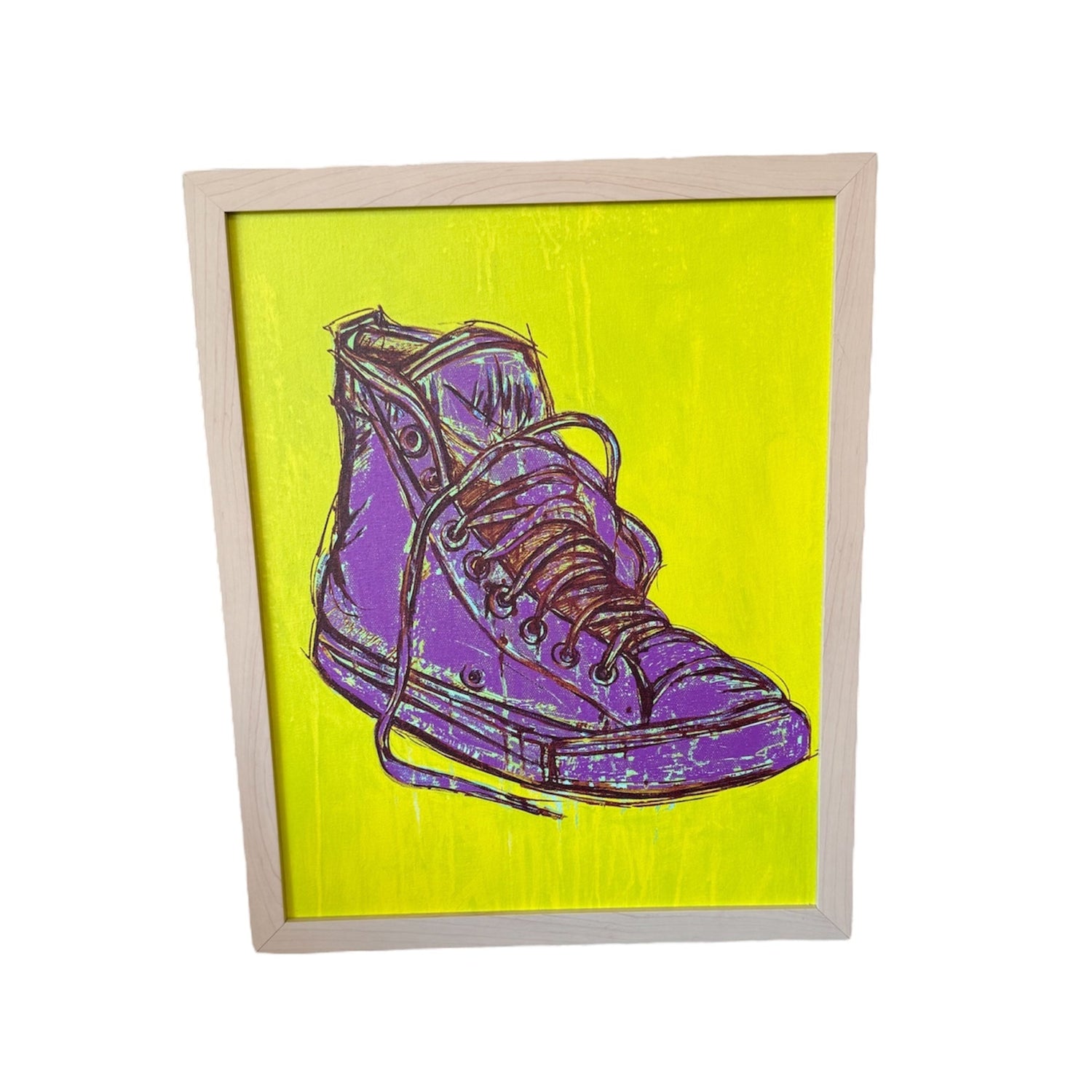 Framed artwork of a purple sneaker on a yellow background