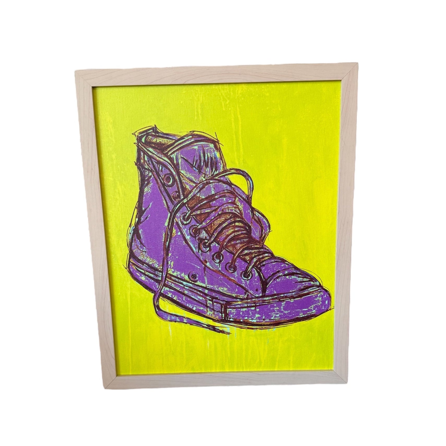 Framed artwork of a purple sneaker on a yellow background