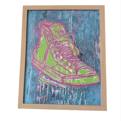 Framed artwork of a green and pink high-top sneaker on a blue textured background
